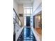 Grand foyer showcasing a soaring ceiling, modern staircase, and elegant black and white marble flooring at 1100 Parker Ne Pl, Atlanta, GA 30324