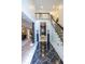 Foyer featuring a staircase, marble flooring, black columns, and entryways into other rooms in the home at 1100 Parker Ne Pl, Atlanta, GA 30324