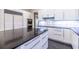 The well-appointed kitchen includes a large island, stainless steel appliances, and sleek white cabinetry at 1100 Parker Ne Pl, Atlanta, GA 30324