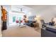 Spacious living room featuring a mini-fridge, built in bookcases and sliding glass doors at 1100 Parker Ne Pl, Atlanta, GA 30324
