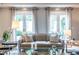 Cozy living room with neutral tones, comfortable seating, and bright French doors at 1100 Parker Ne Pl, Atlanta, GA 30324