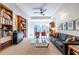 Comfortable living room with built-in bookcases, seating, and abundant natural light at 1100 Parker Ne Pl, Atlanta, GA 30324