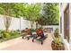 Backyard patio with stylish lounge chairs, outdoor dining set, and manicured garden areas at 1100 Parker Ne Pl, Atlanta, GA 30324