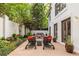 Inviting patio with lounge chairs, dining table, and lush landscaping offers a serene outdoor living space at 1100 Parker Ne Pl, Atlanta, GA 30324