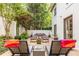 Relaxing patio features lounge chairs, dining table, and lush greenery, perfect for outdoor entertaining at 1100 Parker Ne Pl, Atlanta, GA 30324