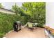 Picturesque patio featuring a grill and outdoor table, framed by vibrant ivy and greenery at 1100 Parker Ne Pl, Atlanta, GA 30324