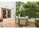 Charming patio with an outdoor table and grill, surrounded by lush greenery and a brick wall at 1100 Parker Ne Pl, Atlanta, GA 30324