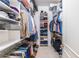 Well-organized walk-in closet with ample shelving and hanging space for clothes and storage at 1100 Parker Ne Pl, Atlanta, GA 30324