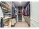Organized walk-in closet with built-in shelving, hanging racks, and ample storage space for clothing and accessories at 1100 Parker Ne Pl, Atlanta, GA 30324