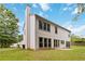 An exterior rear view of the home shows the siding and backyard at 1931 Abinger Way, Lawrenceville, GA 30043