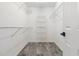 Walk-in closet with wire shelving and neutral paint at 1931 Abinger Way, Lawrenceville, GA 30043