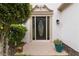 Elegant front door with decorative glass and manicured landscaping at 1931 Abinger Way, Lawrenceville, GA 30043
