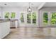 Bright kitchen and dinette with stainless appliances, wood floors and view of the backyard at 1931 Abinger Way, Lawrenceville, GA 30043
