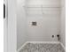 Laundry room with patterned tile floor and neutral paint at 1931 Abinger Way, Lawrenceville, GA 30043