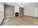 Living room showing fireplace and hardwood floors at 1931 Abinger Way, Lawrenceville, GA 30043