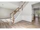 View of staircase highlighting wood trim and wainscoting at 1931 Abinger Way, Lawrenceville, GA 30043