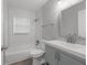 Modern bathroom featuring stylish vanity, bathtub with subway tile surround, and updated fixtures at 2917 Reveille Se Cir, Atlanta, GA 30316