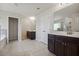 Spacious bathroom featuring double vanities, tile floors, and a separate shower and soaking tub at 3373 Shoals Ridge Dr, Dacula, GA 30019