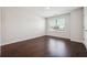 Bright bedroom features hardwood floors, neutral walls, and a window providing natural light at 3373 Shoals Ridge Dr, Dacula, GA 30019