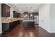 Spacious kitchen featuring stainless steel appliances, granite countertops, and a central island at 3373 Shoals Ridge Dr, Dacula, GA 30019
