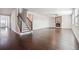 Living room features hardwood floors, neutral paint, and a cozy fireplace at 3373 Shoals Ridge Dr, Dacula, GA 30019