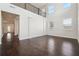 Bright living room with hardwood floors, high ceilings, and large windows for abundant natural light at 3373 Shoals Ridge Dr, Dacula, GA 30019