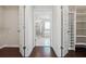 Walk-in closet leads into the bathroom with glass enclosed shower and soaking tub at 3373 Shoals Ridge Dr, Dacula, GA 30019