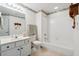 Bathroom showcases floral wallpaper trim, shower-tub combo and neutral-toned vanity at 3746 Vineyards Lake Nw Cir # U6, Kennesaw, GA 30144