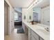 Bathroom features long vanity with dual sinks, floral wallpaper trim, and doorway to bedroom at 3746 Vineyards Lake Nw Cir # U6, Kennesaw, GA 30144