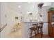 Bright kitchen bar and dining area features white cabinets, lots of light and plenty of room at 3746 Vineyards Lake Nw Cir # U6, Kennesaw, GA 30144