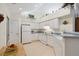 Bright kitchen with white cabinets, appliances, and a vaulted ceiling at 3746 Vineyards Lake Nw Cir # U6, Kennesaw, GA 30144
