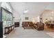 Spacious living room with neutral tones, a fireplace, high ceiling, and a seamless flow into the dining area at 3746 Vineyards Lake Nw Cir # U6, Kennesaw, GA 30144