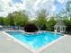 Refreshing community pool with blue water, lounge chairs, and a gazebo for relaxation at 3746 Vineyards Lake Nw Cir # U6, Kennesaw, GA 30144