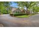 Residential street view of homes with well-kept landscaping and mature trees in a suburban neighborhood at 3746 Vineyards Lake Nw Cir # U6, Kennesaw, GA 30144
