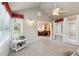 Cozy sunroom with lots of natural light, carpet flooring, and access to the living area at 3746 Vineyards Lake Nw Cir # U6, Kennesaw, GA 30144