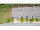 Aerial view of the townhouse roofline with nearby trees and landscaping at 7168 Kingswood Run Dr, Atlanta, GA 30340