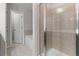 Bathroom features a tile shower with glass door and a soaking tub at 7168 Kingswood Run Dr, Atlanta, GA 30340