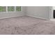 Bedroom featuring a large carpeted area with natural light from large windows at 7168 Kingswood Run Dr, Atlanta, GA 30340
