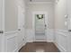 Inviting foyer with hardwood floors and elegant trim, leading to the main living areas at 7168 Kingswood Run Dr, Atlanta, GA 30340
