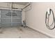 View of the garage with automatic garage door opener and EV charger at 7168 Kingswood Run Dr, Atlanta, GA 30340