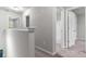 Upstairs hallway with carpet and multiple doorways at 7168 Kingswood Run Dr, Atlanta, GA 30340