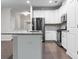 Contemporary kitchen featuring a large island, stainless steel appliances, and hardwood floors at 7168 Kingswood Run Dr, Atlanta, GA 30340