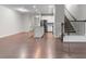 Spacious open-concept living room with beautiful hardwood floors and staircase at 7168 Kingswood Run Dr, Atlanta, GA 30340
