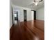Bedroom with hardwood floors, a walk-in closet, and a door leading to an en-suite bathroom at 1001 Park Gate Pl, Stone Mountain, GA 30083