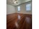 Bedroom with hardwood floors, natural light, and two windows, creating a warm and inviting atmosphere at 1001 Park Gate Pl, Stone Mountain, GA 30083