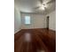 A large, well-lit bedroom features sleek hardwood floors and a ceiling fan at 1001 Park Gate Pl, Stone Mountain, GA 30083