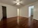 A large, well-lit bedroom features sleek hardwood floors and three entryways at 1001 Park Gate Pl, Stone Mountain, GA 30083