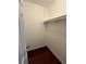 Walk-in closet features wood floors and a metal hanging rack at 1001 Park Gate Pl, Stone Mountain, GA 30083