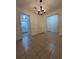 Bright dining room with tile floors and access to the kitchen at 1001 Park Gate Pl, Stone Mountain, GA 30083