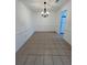 Spacious dining room with tile floors and a modern chandelier at 1001 Park Gate Pl, Stone Mountain, GA 30083